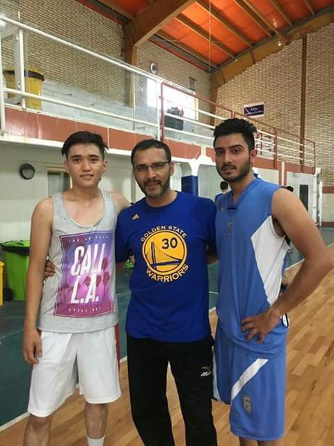 Coach Jafari with Young Players in the Gym