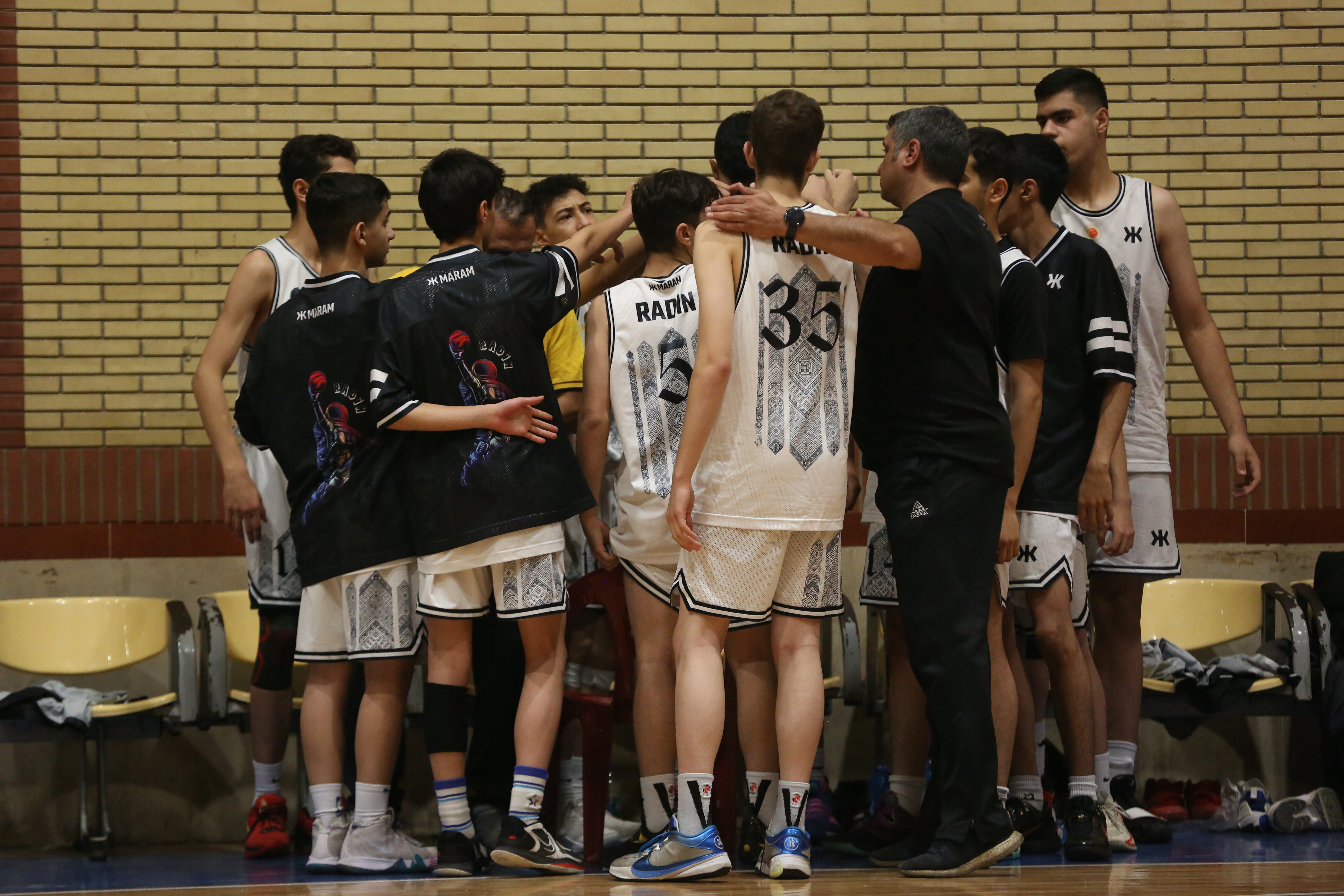 Radin Huddle · White Jerseys Before Tip-Off