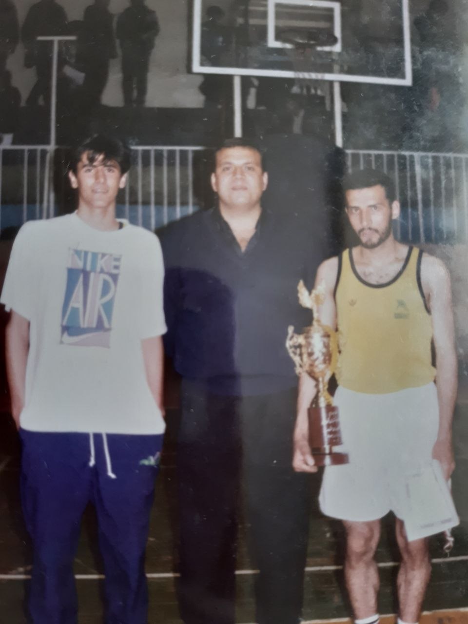 Archive · Coach and Players with Trophy