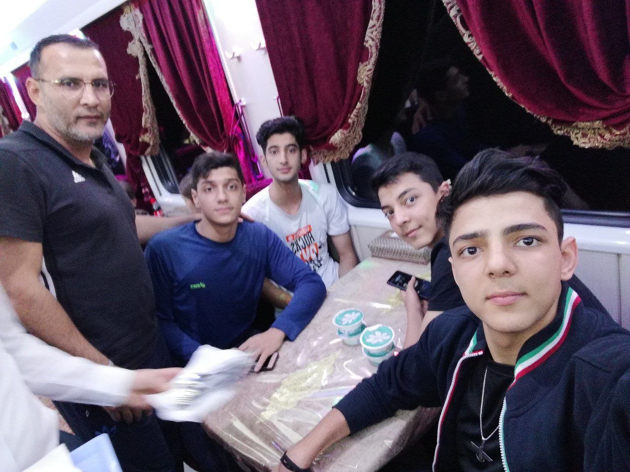 Road Trip · Coach Jafari with Players on the Bus