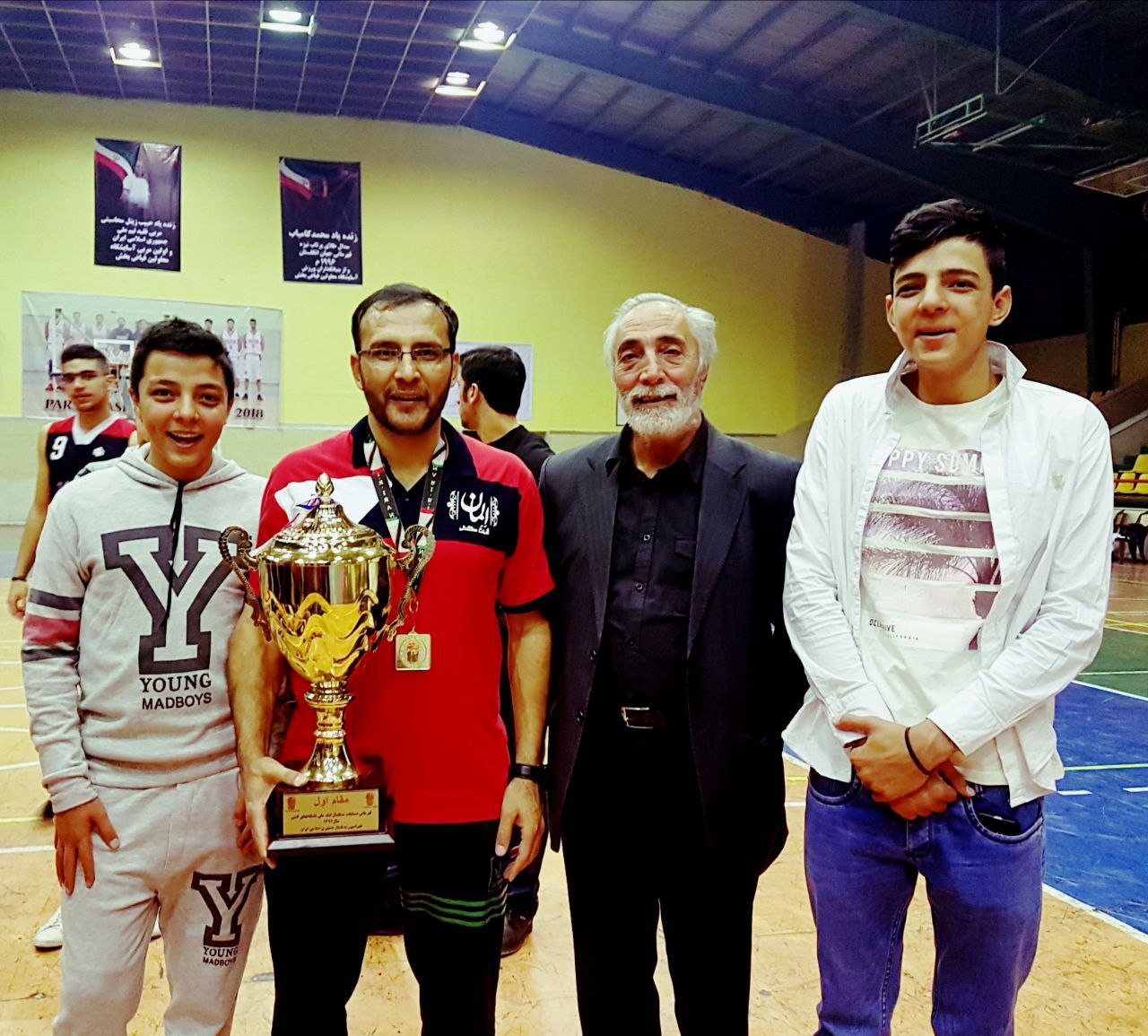 First-Place Trophy with Veteran Legend & Young Players